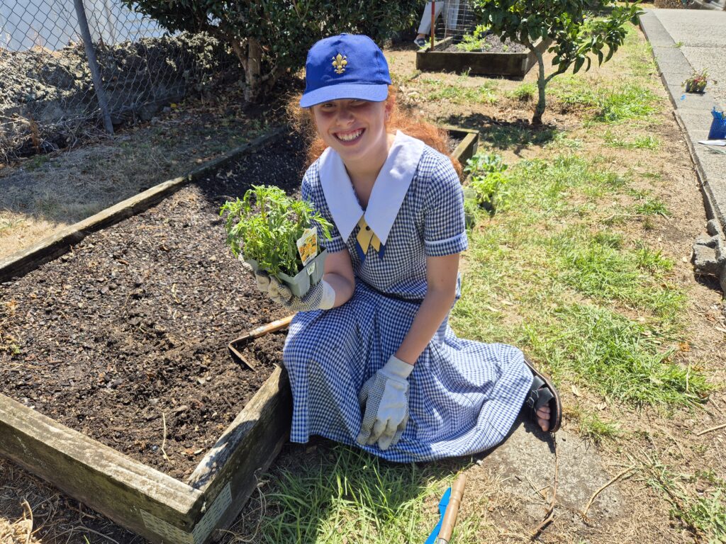 Girl in cap gardening