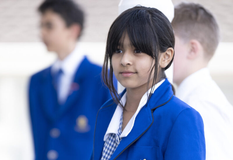 Young girl waring a blue blazer