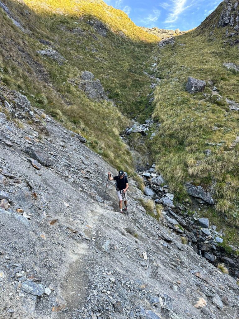 a man climbing a rocky mountain