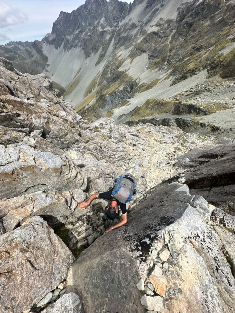 a person climbing a rocky mountain