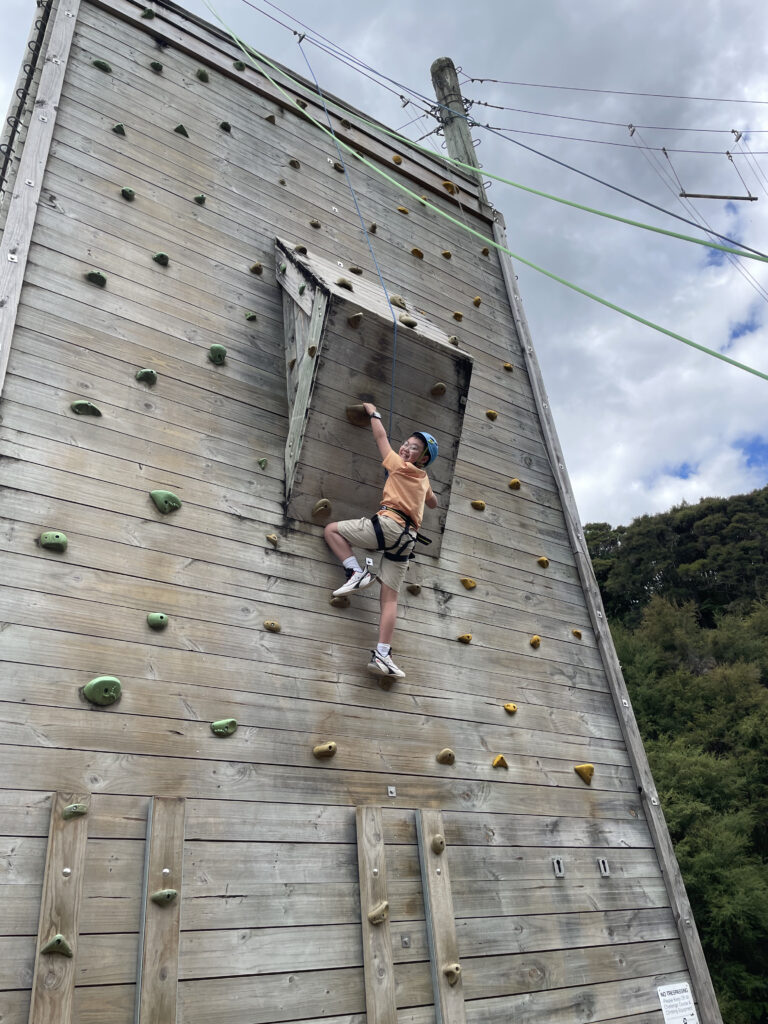 boy on climbing wall