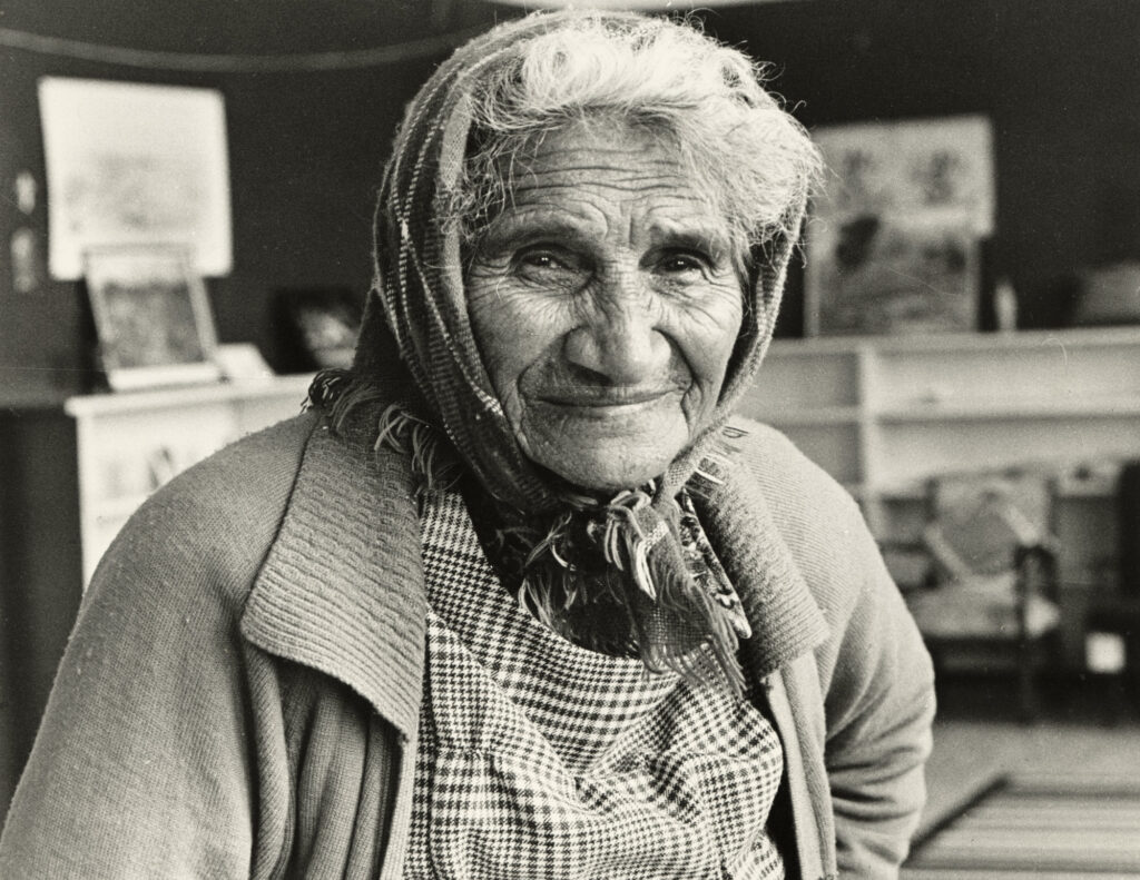 Elderly woman wearing headscarf