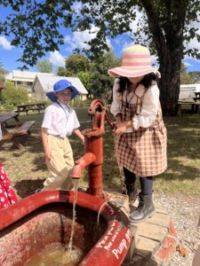 Children using water pump