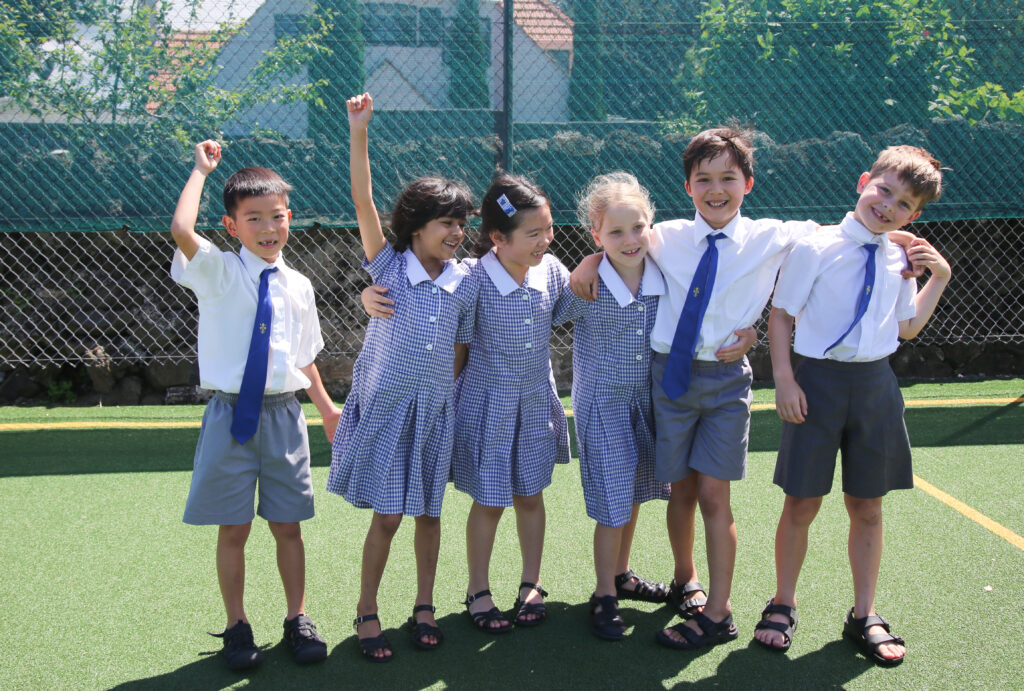 a group of happy young children smiling