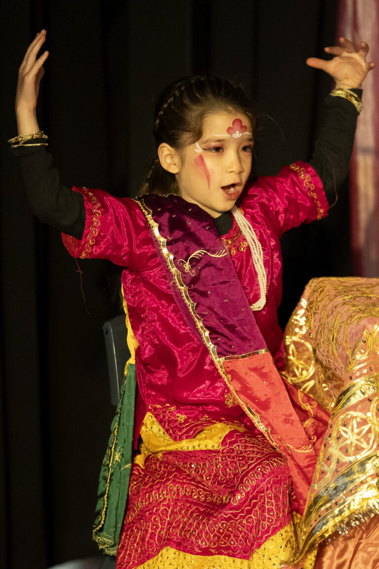 Young girl wearing a red sari
