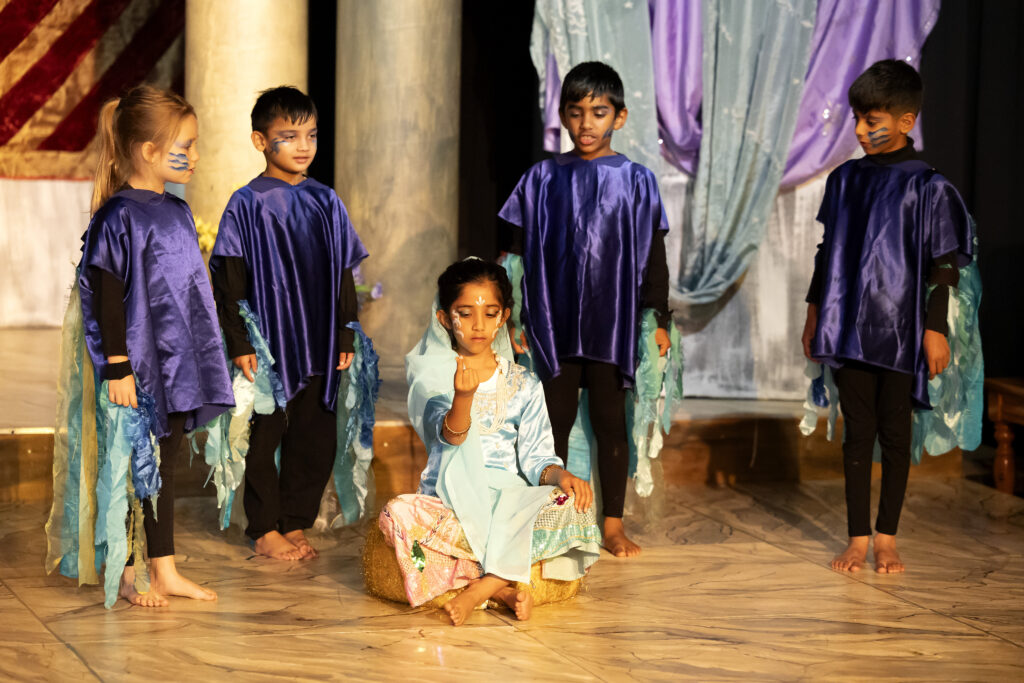 Primary school children performing a play