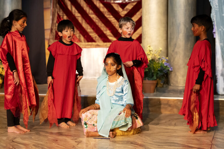 school children performing a play