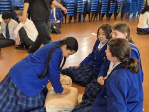 Girls learning CPR