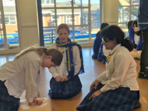 Girls learning CPR