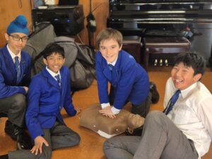 Boys learning CPR