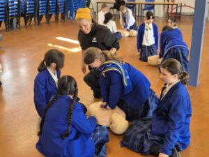 Girls learning CPR