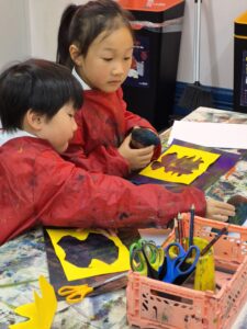 Young children making art