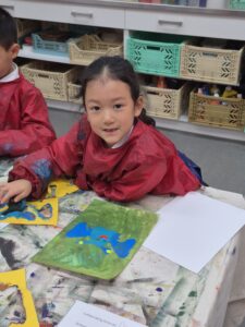 Young girl making stamps