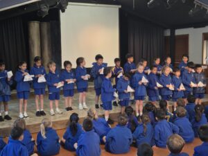 Children standing on stage