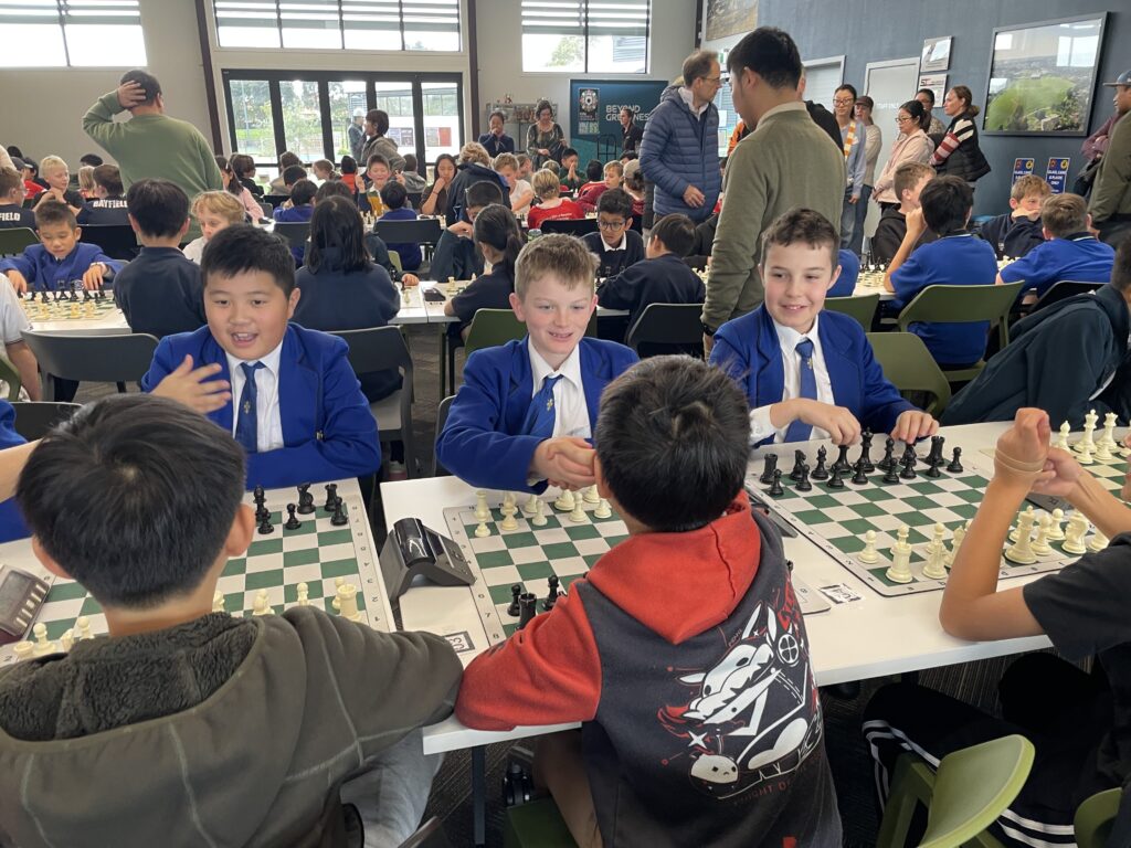 A group of boys playing chess
