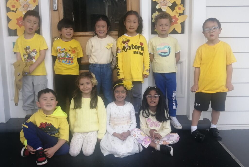 Young children sittin on steps