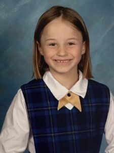 A young schoolgirl in uniform