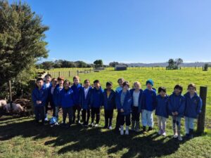 Young students have group shot at farm during practical learning experience