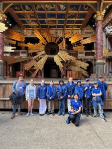 Children stand in front of stage
