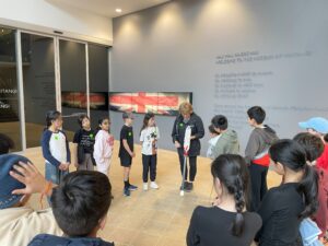 Young children observe staff at Museum of Waitangi