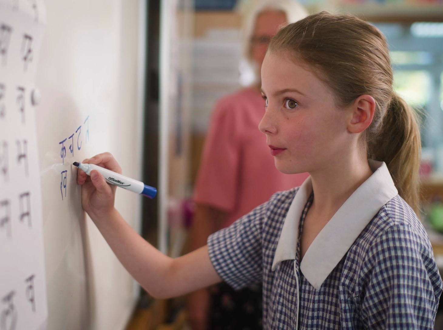 Young girl learning Sanskrit