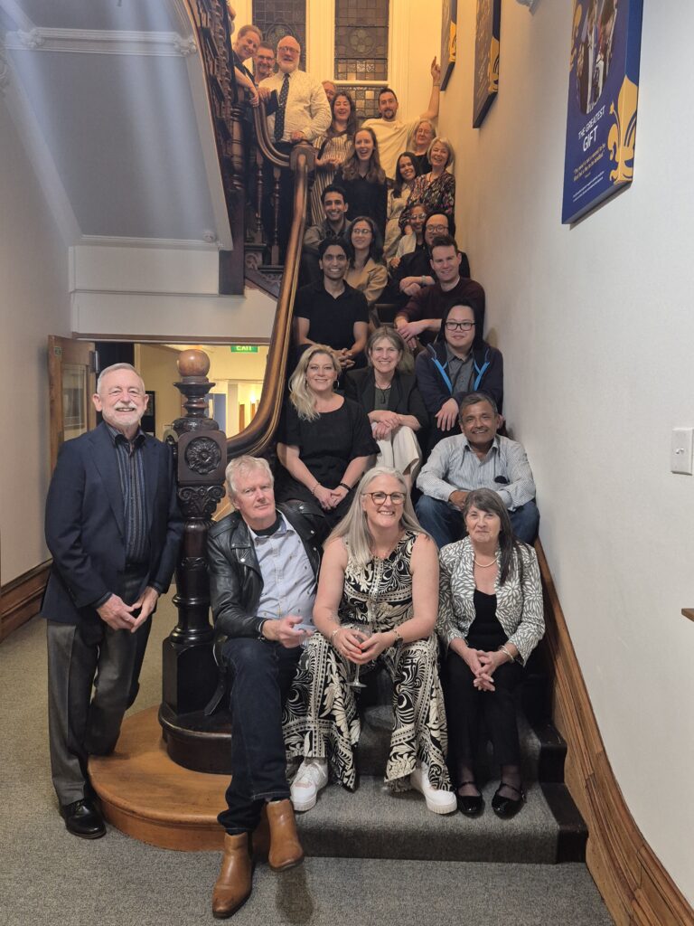 A group of people sitting on a staircase
