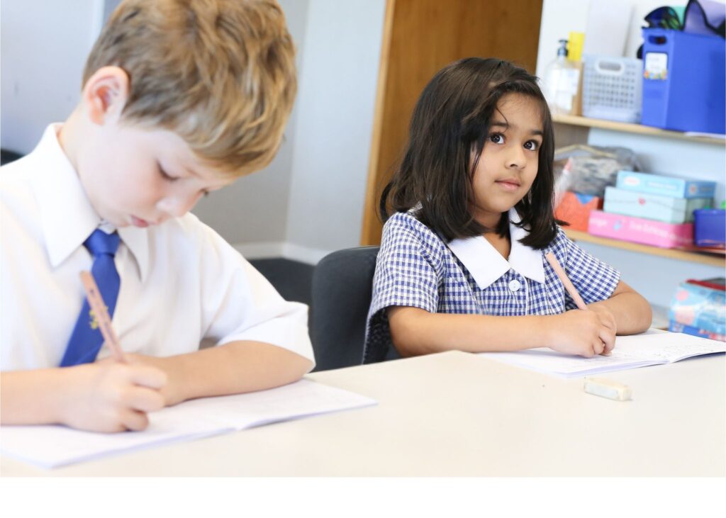 Two young children studying