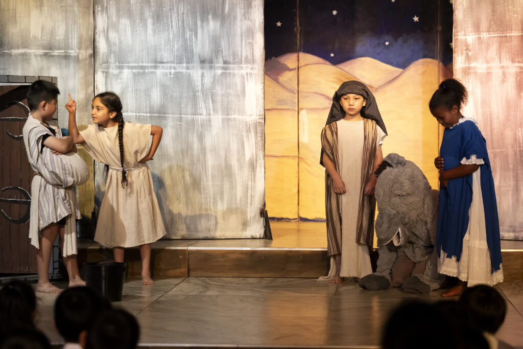 School chldren performing a play