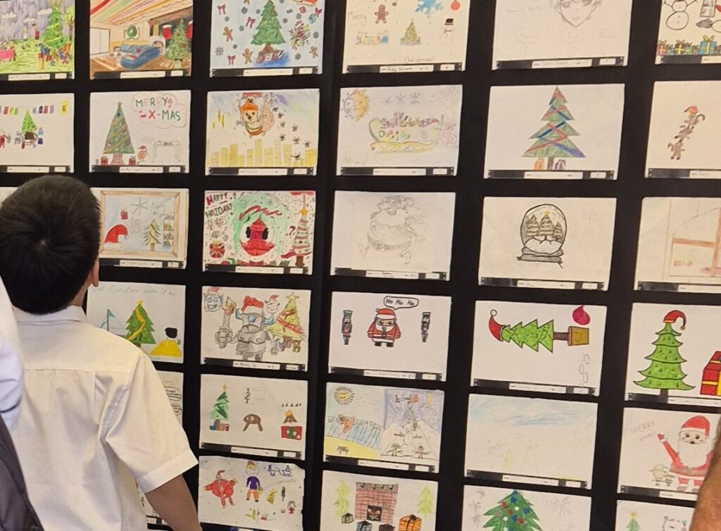 A boy looking at an art display