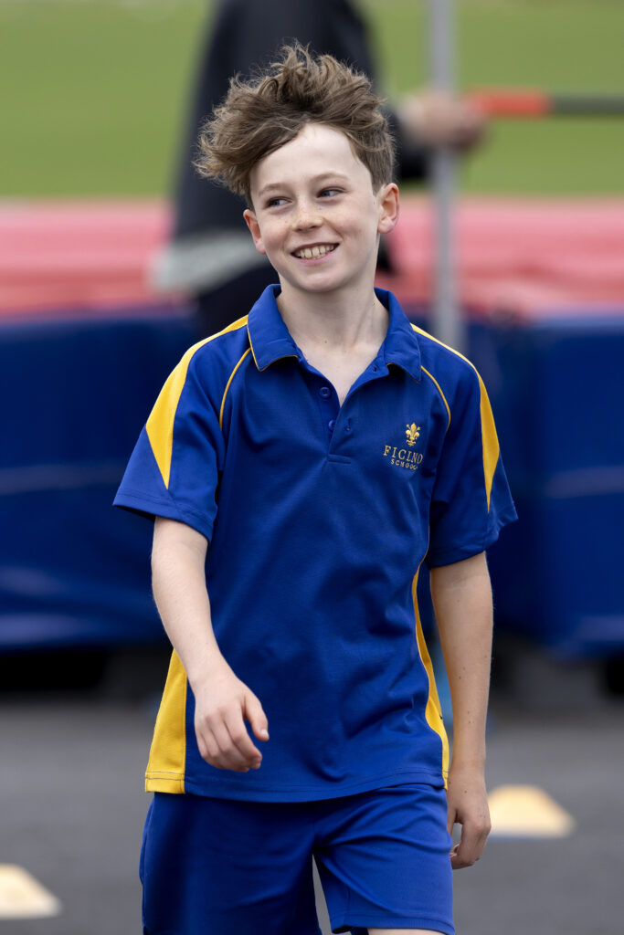 Boy wearing blue sports gear