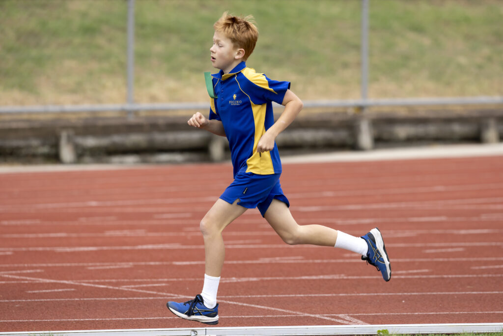 Boy running on a track