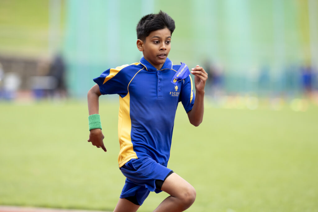 Indian boy running on a track