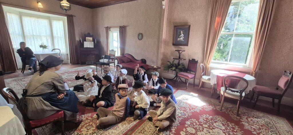 People sitting on the floor in an old house