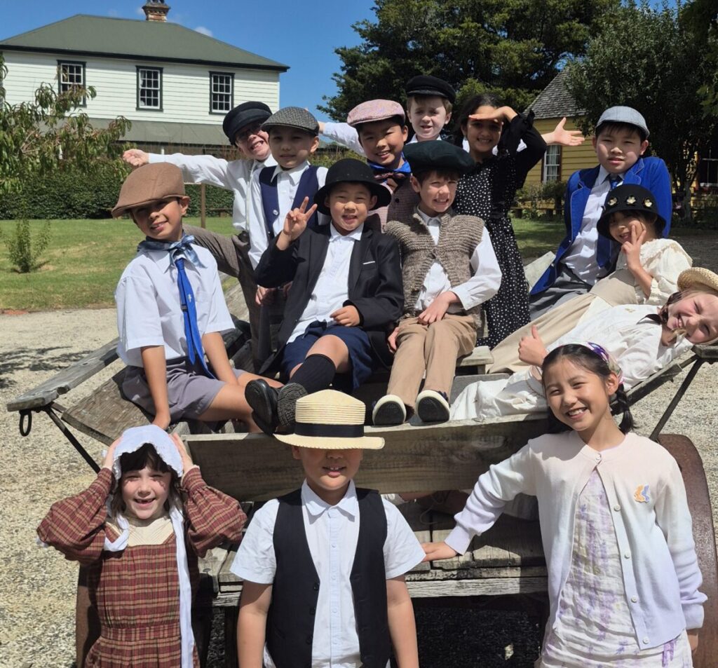 A group of children sitting in a horse cart
