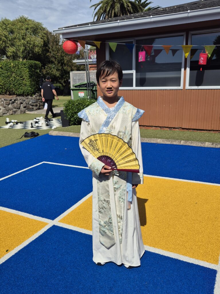 Chinese boy wearing traditional dress