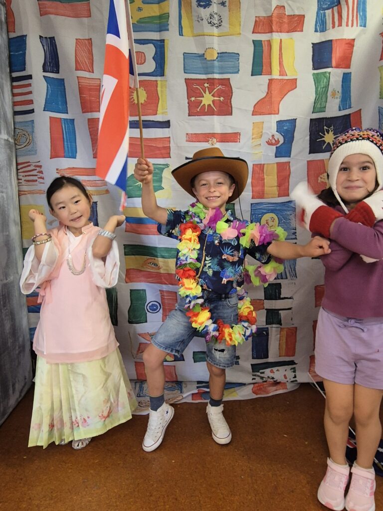 Young children posing in international costumes