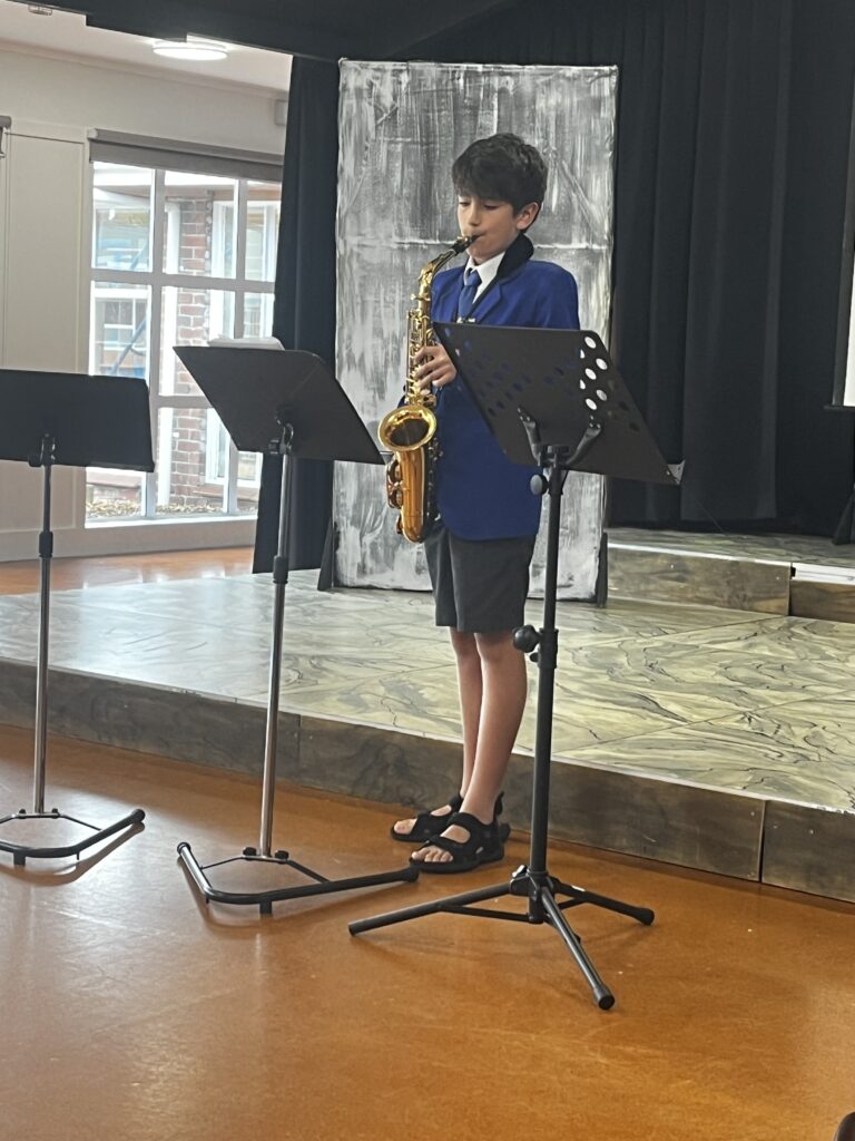 Boy playing saxophone