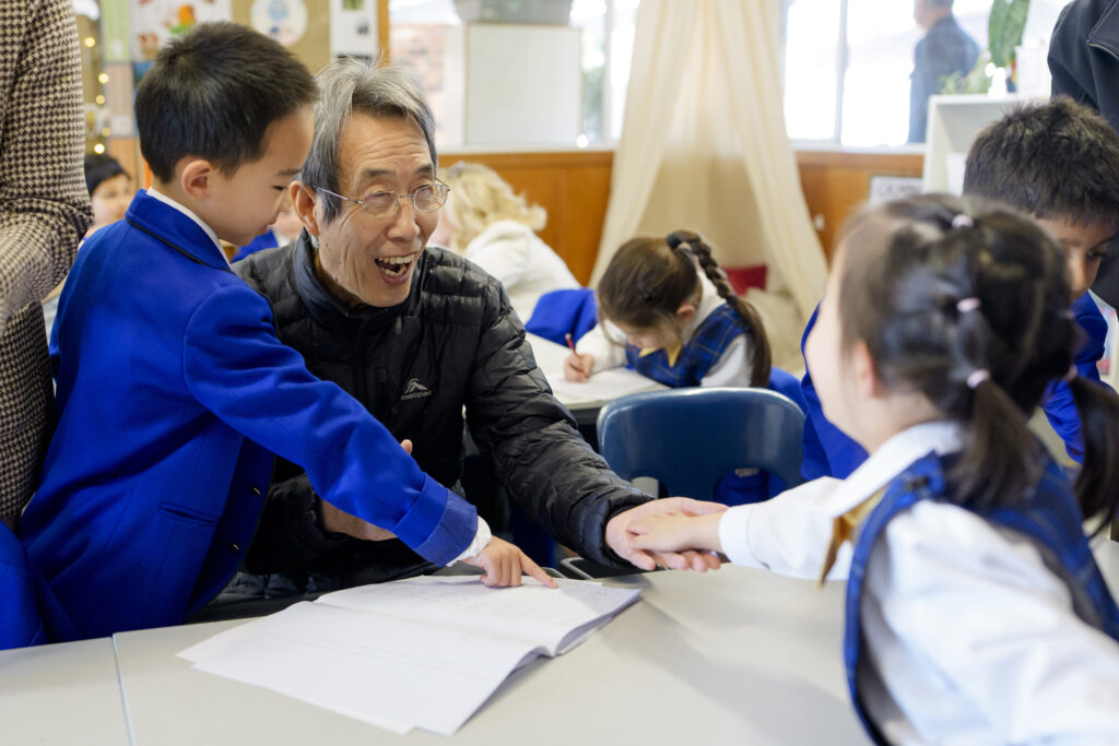 Elderly man interacting with children