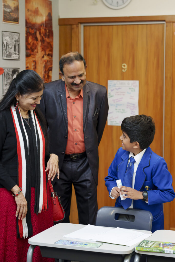 Indian grandparents talking to their grandson