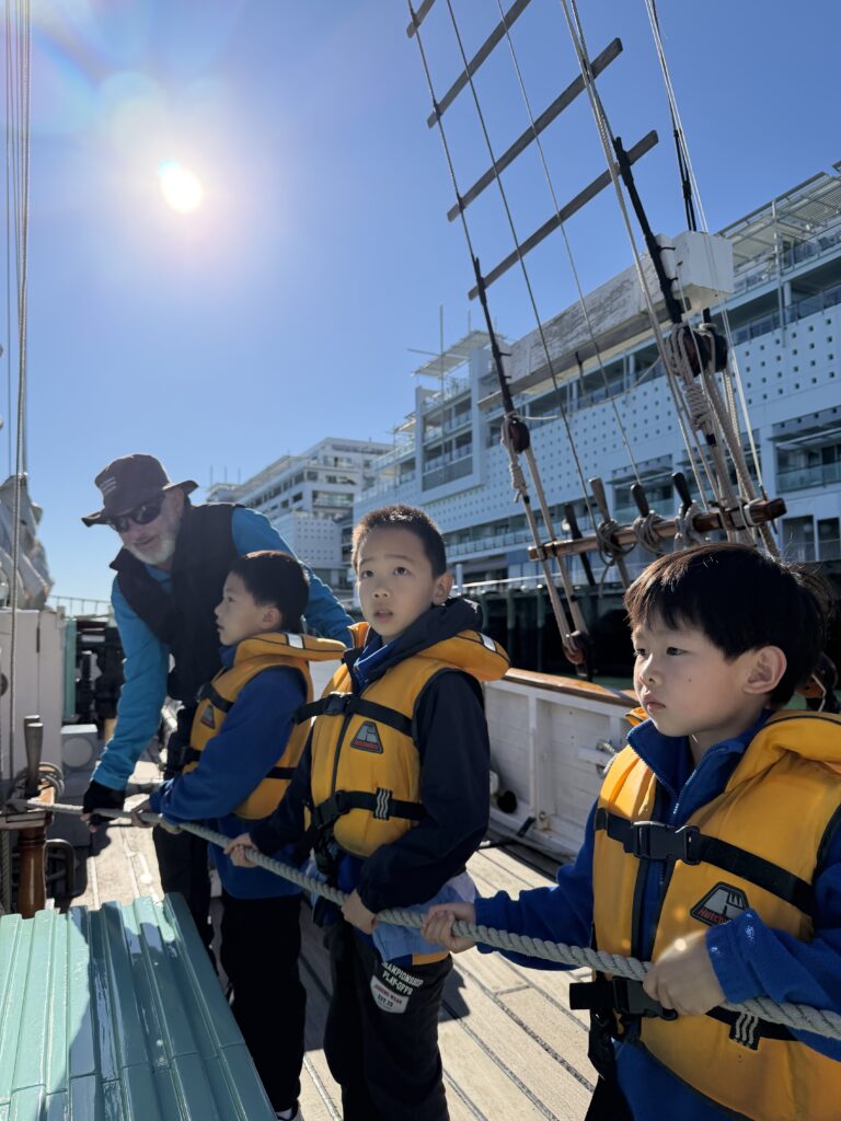A group pf children on a boat